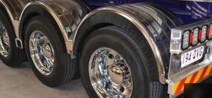 Chromed wheels and polished guards at the back of a trailer